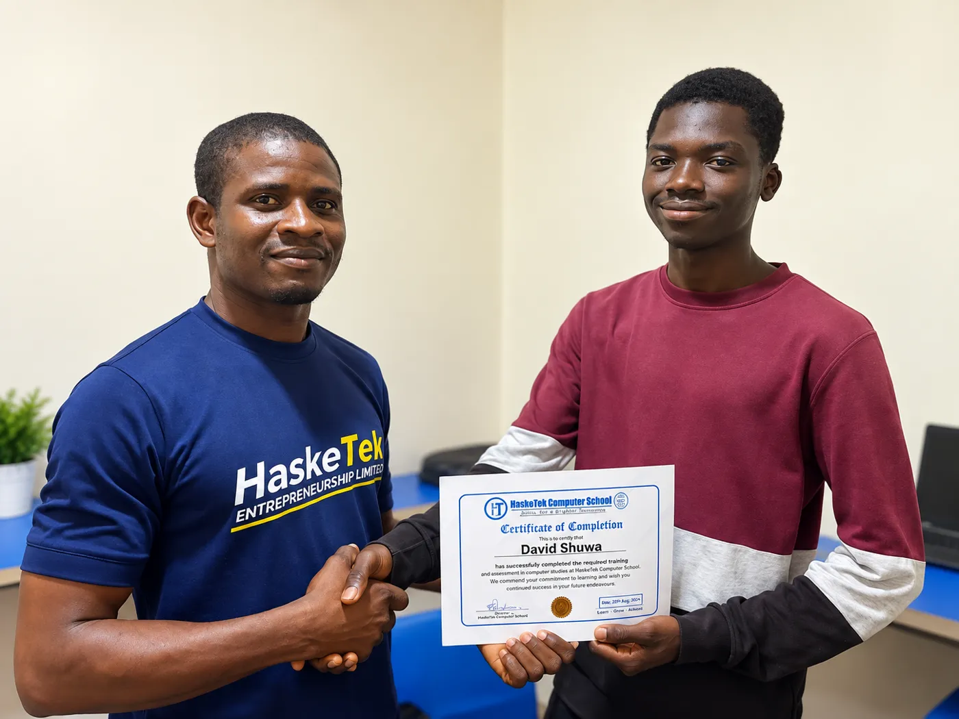 HaskeTek Computer School graduate David Shuwa receiving his Certificate of Completion