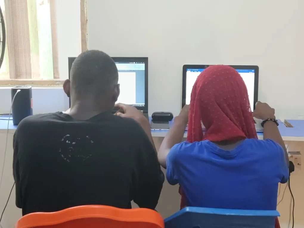 Two HCS students working on Microsoft Word during class